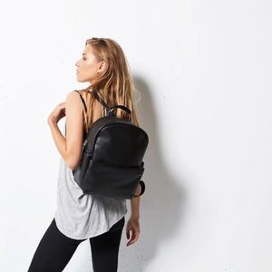 Black leather backpack by Status Anxiety